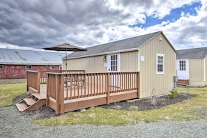 A single-story building with a wooden deck and a covered patio area. - Double Retreat · Poconos Nature Escape (Pleasant Mount)