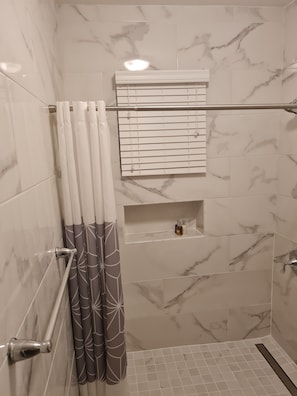 Combined shower/tub, hair dryer, towels, soap