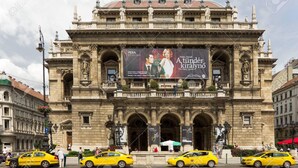 A historic building with ornate architecture, featuring a large billboard advertising a musical. - THE TOTAL APPARTMENT IS YOURS ALONE (BUDAPEST)
