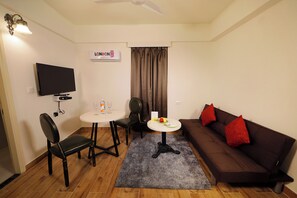 Suite Twin Room | Living area | 55-inch LED TV with satellite channels, TV - The Altruist Business Hotel, Whitefield (Bengaluru)