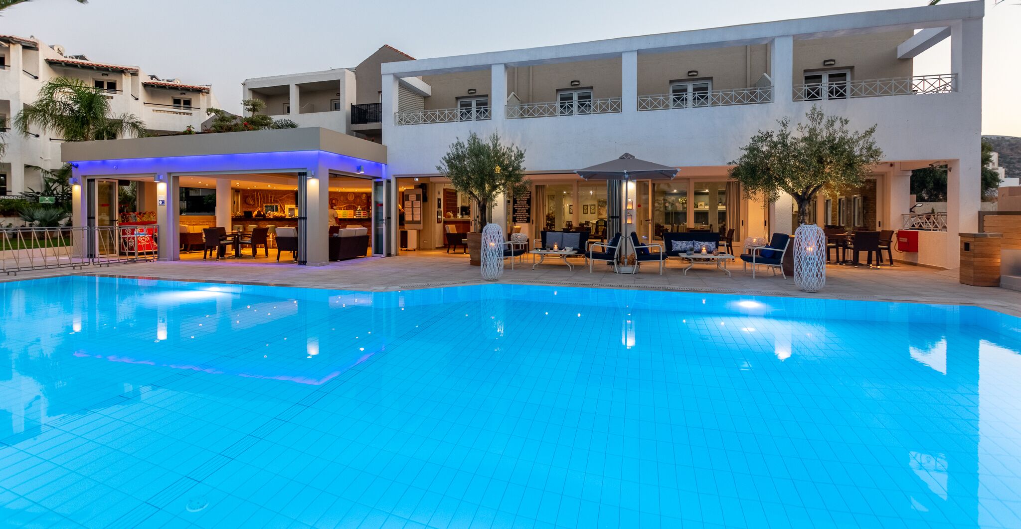 seasonal outdoor pool, open 9:00 am to 8:00 pm, pool umbrellas