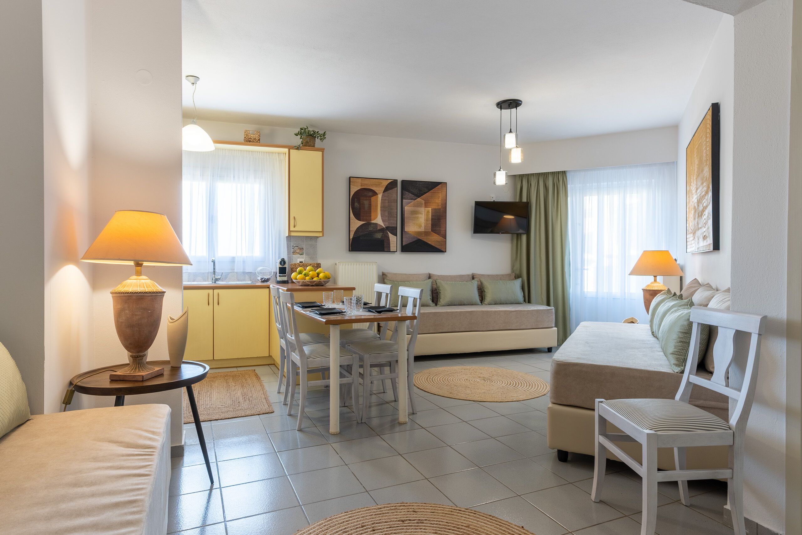 standard one bedroom quintuple apartment | living area | 32-inch flat-screen tv with satellite channels