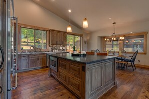 Enjoy cooking in this well-lit kitchen with ample counter space and a large island.
