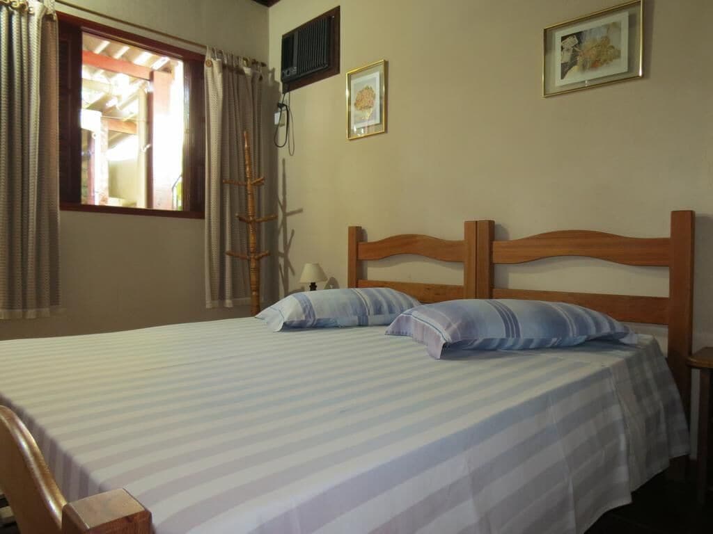 Quarto conforto | Frigobar, Wi-Fi de cortesia, roupa de cama