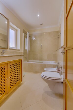 Bathtub, hair dryer, towels