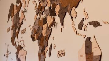 A world map made of wood pieces, with country names labeled.