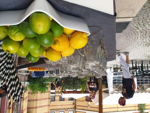 A restaurant with a unique ceiling display of lemons and limes. - two-room WHG in the center (Leipzig)