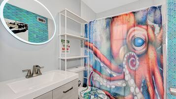 Shower, hair dryer, towels, soap