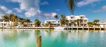 Beachy getaway with pool, water views, furnished patio, & dock access