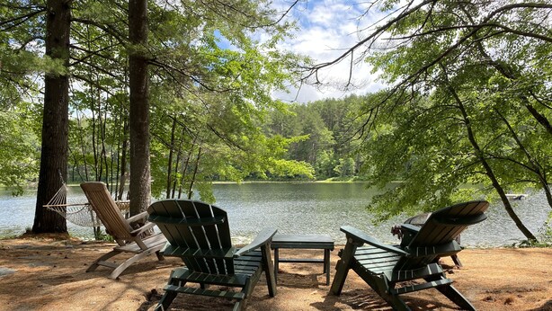 A lakeside campsite with Adirondack chairs and a picnic table. - Lakeside home. Fishing, paddle boarding, swimming, and easy lake  fun.  (Warner)