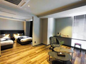 A modern hotel room with two beds, a small table, a chair, and a large window with blinds. - Hotel S-presso South (Osaka)