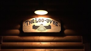 A wooden sign with the text "THE LOO-UVRE" and a pyramid design. - Moonlight Cottage “Hoot”, sleeps 5 (Rigby)
