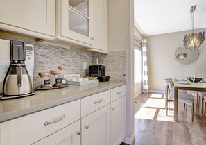 Microwave, dishwasher, coffee/tea maker, cookware/dishes/utensils