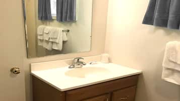 Combined shower/tub, hair dryer, towels, soap