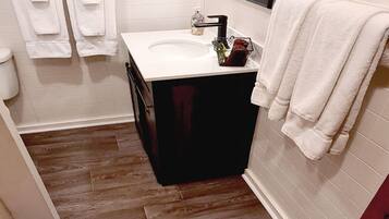 Combined shower/tub, hair dryer, towels, soap