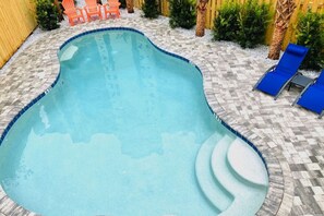 A heated pool - Sand Castle ~ 3-Story Beach Retreat with Heated Pool, Tiki Bar & Dual Game Rooms (Panama City Beach)