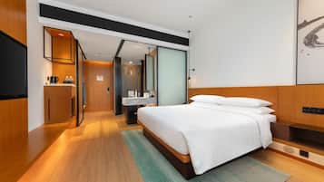 Premium bedding, down comforters, free minibar, in-room safe