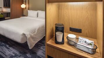 Habitación de hotel con una cama bien hecha, una mesita de noche con una cafetera, una taza y una bandeja con sobres de café.
