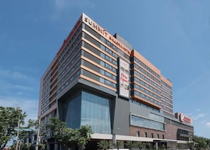 A multi-story hotel with a modern design, featuring a prominent 'Summit' sign and a 'Now Open!' banner. - Summit Galleria Cebu (Cebu City)