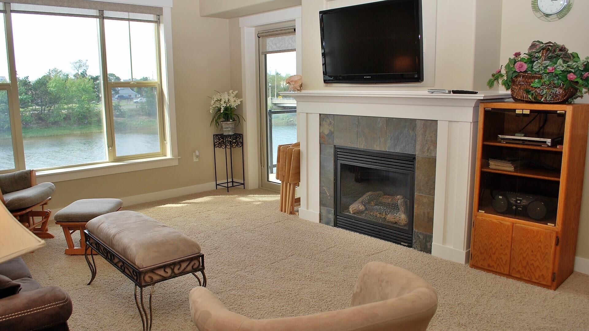 Apartment, Multiple Beds (Apartment with Balcony) | Living room | Fireplace