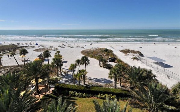On the beach, sun loungers, beach towels