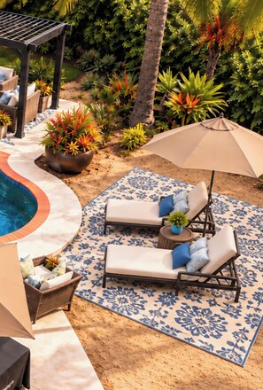 A poolside area with two lounge chairs, a large umbrella, and a decorative rug. - Private Lux Bungalow - Pool + Spa l
Pet Paradise (Oceanside)