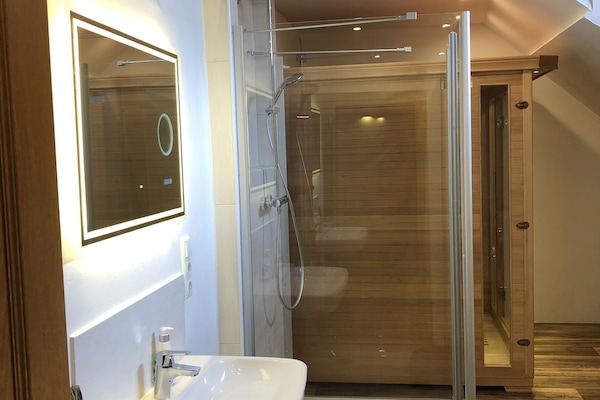 Shower, hair dryer, towels, soap