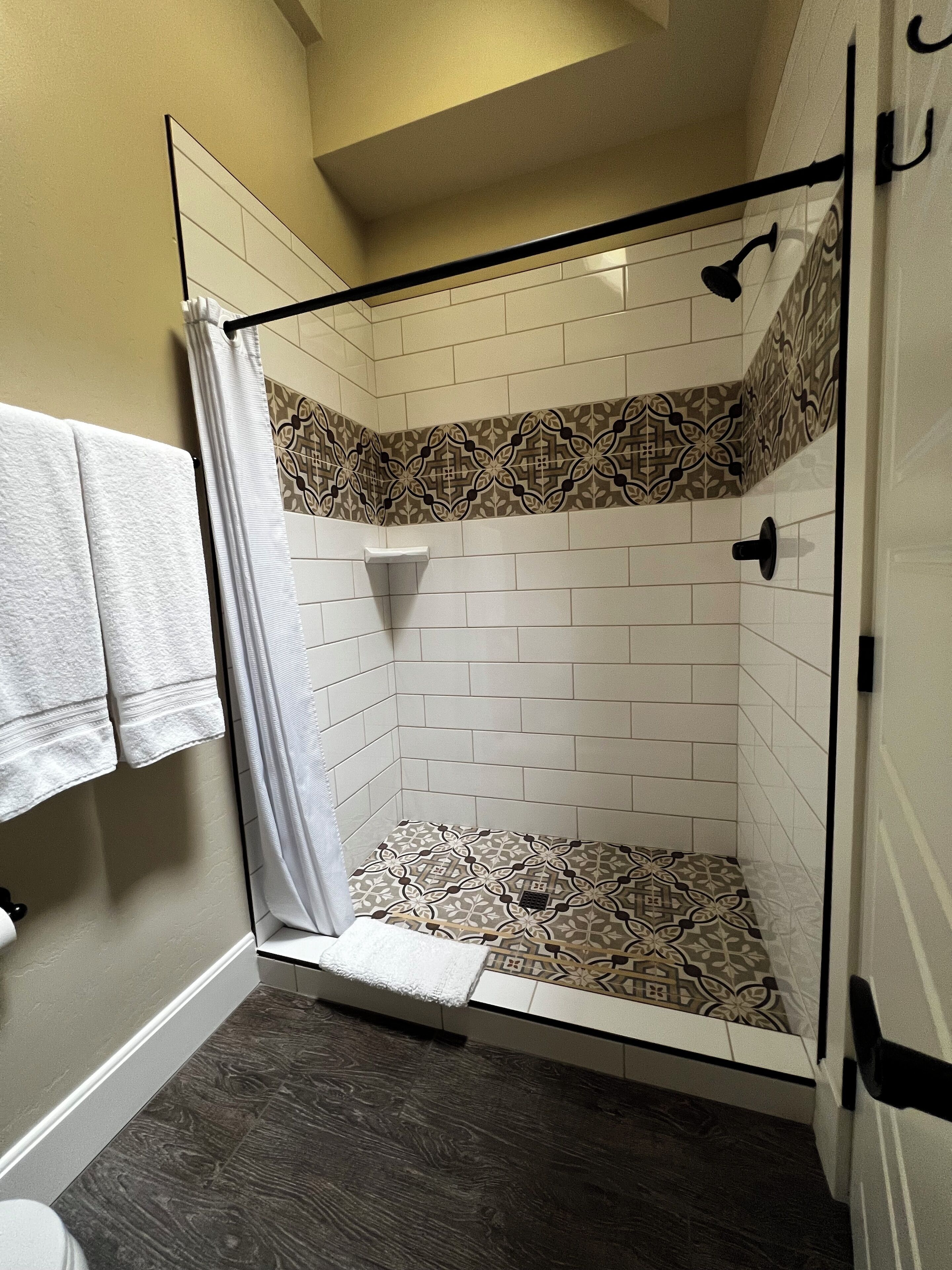 deluxe room | bathroom | shower, designer toiletries, hair dryer, towels