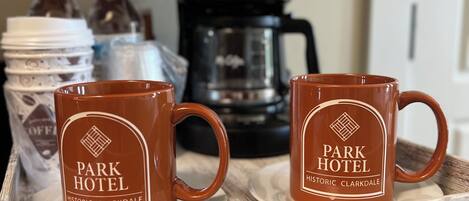 Two brown mugs with "Park Hotel Historic Clarkdale" text on a tray.