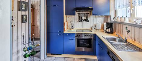 Fridge, stovetop, dishwasher, coffee/tea maker