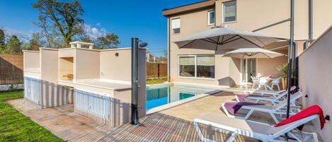 Outdoor pool, a heated pool, pool loungers