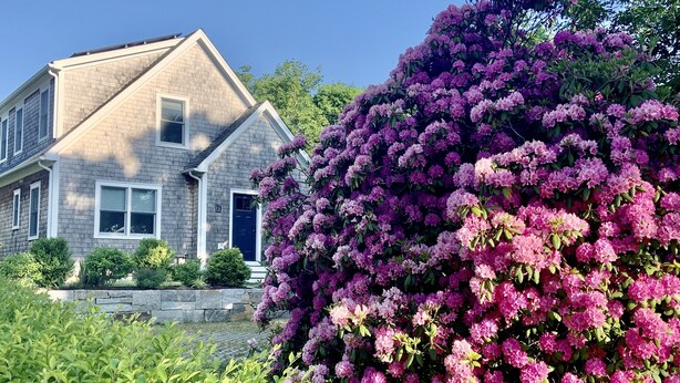 A house with a stone foundation, a grey brick exterior, and a blue door. - Newly built house, Central A/C, Walk to ferry, beach, and town (Tisbury)