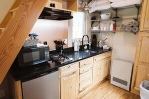 Microwave, stovetop, coffee/tea maker, toaster