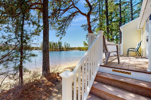 Tranquil lakefront cottage with private beach, boat slip & fishing kayak access