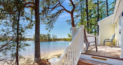 Tranquil lakefront cottage with private beach, boat slip & fishing kayak access