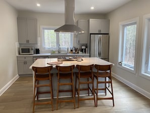 Enjoy meals and snacks at the central island with cabinets and appliances.