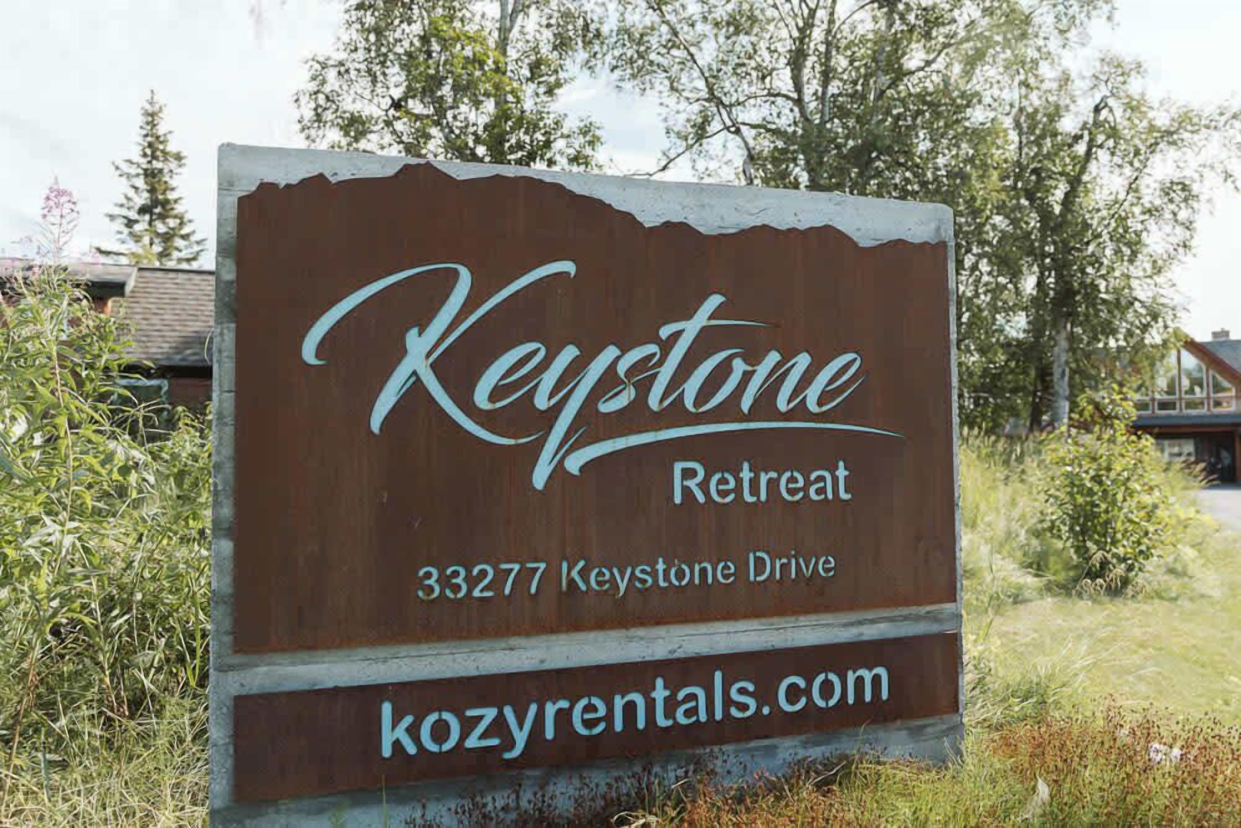 A sign for Keystone Retreat at 33277 Keystone Drive.