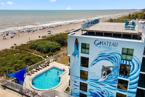 A heated pool - Oceanview Condo w/ Balcony – Steps to Cocoa Beach Pier! (Cocoa Beach)