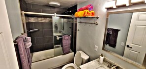 Combined shower/bathtub, hair dryer, towels, soap
