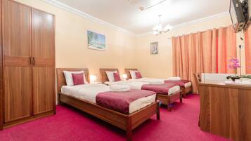 Standard Triple Room | Blackout drapes, soundproofing, iron/ironing board, bed sheets