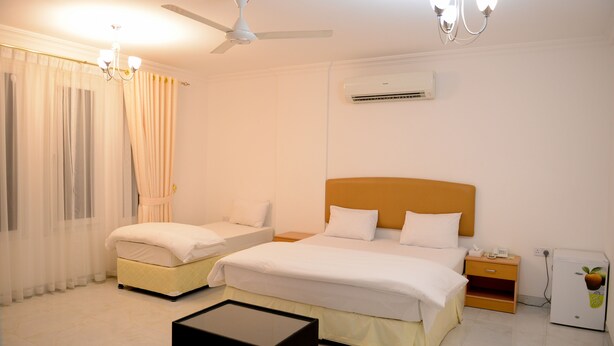 Standard Triple Room | Desk, laptop workspace - Oasis Hotel Apartments (Muscat)
