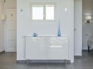 A white cabinet with two drawers and a small window above it. - Your long term rental beachfront apartment in Puerto de Alcúdia. (Puerto de Alcudia)