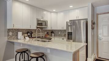 Condo, 2 Bedrooms | Private kitchen | Fridge, microwave, oven, dishwasher