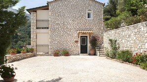 A stone building with a small entrance and a balcony. - Villa Marianthi with private pool  (2 Bedrooms, Sleeps 4) (Corfu, Peloponnisos Dytiki Ellada ke Ionio)