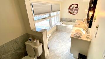 Shower, jetted tub, hair dryer, towels