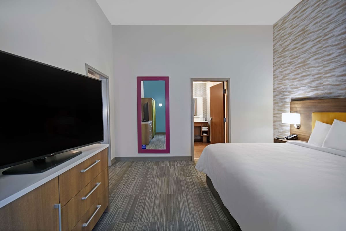 Hypo-allergenic bedding, desk, laptop workspace, blackout curtains