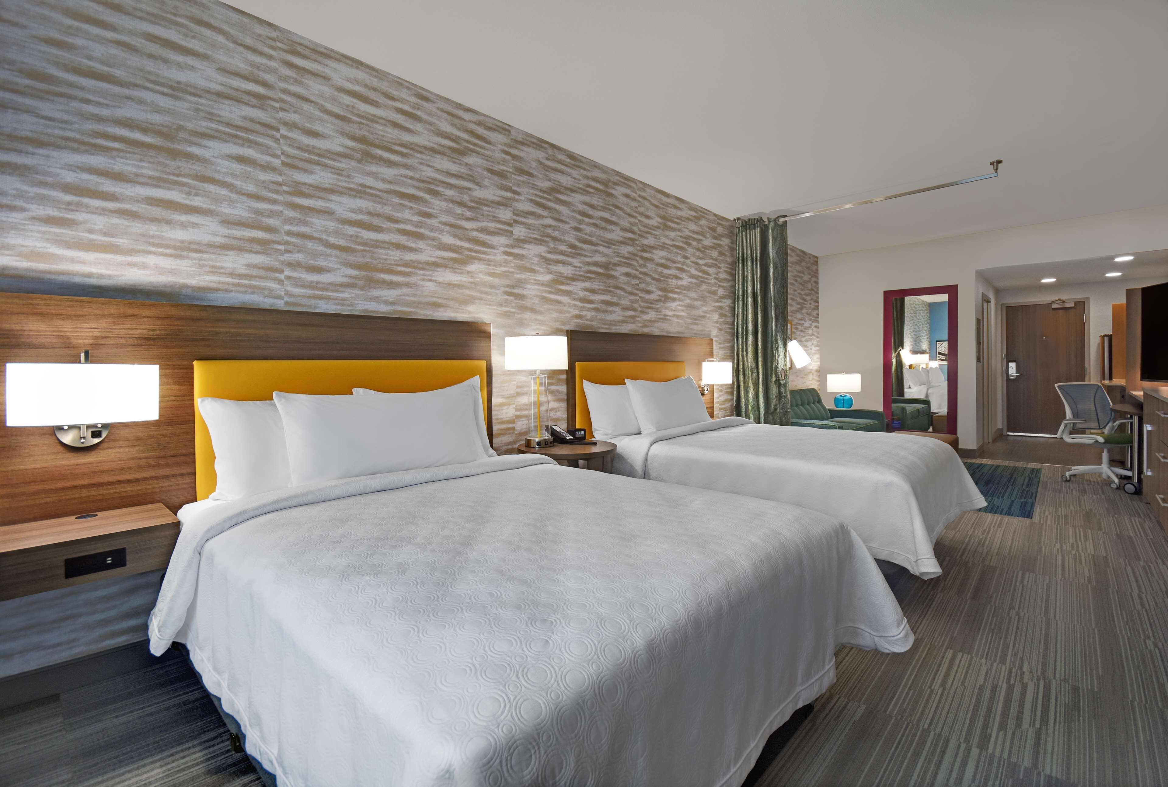 hypo-allergenic bedding, desk, laptop workspace, blackout curtains