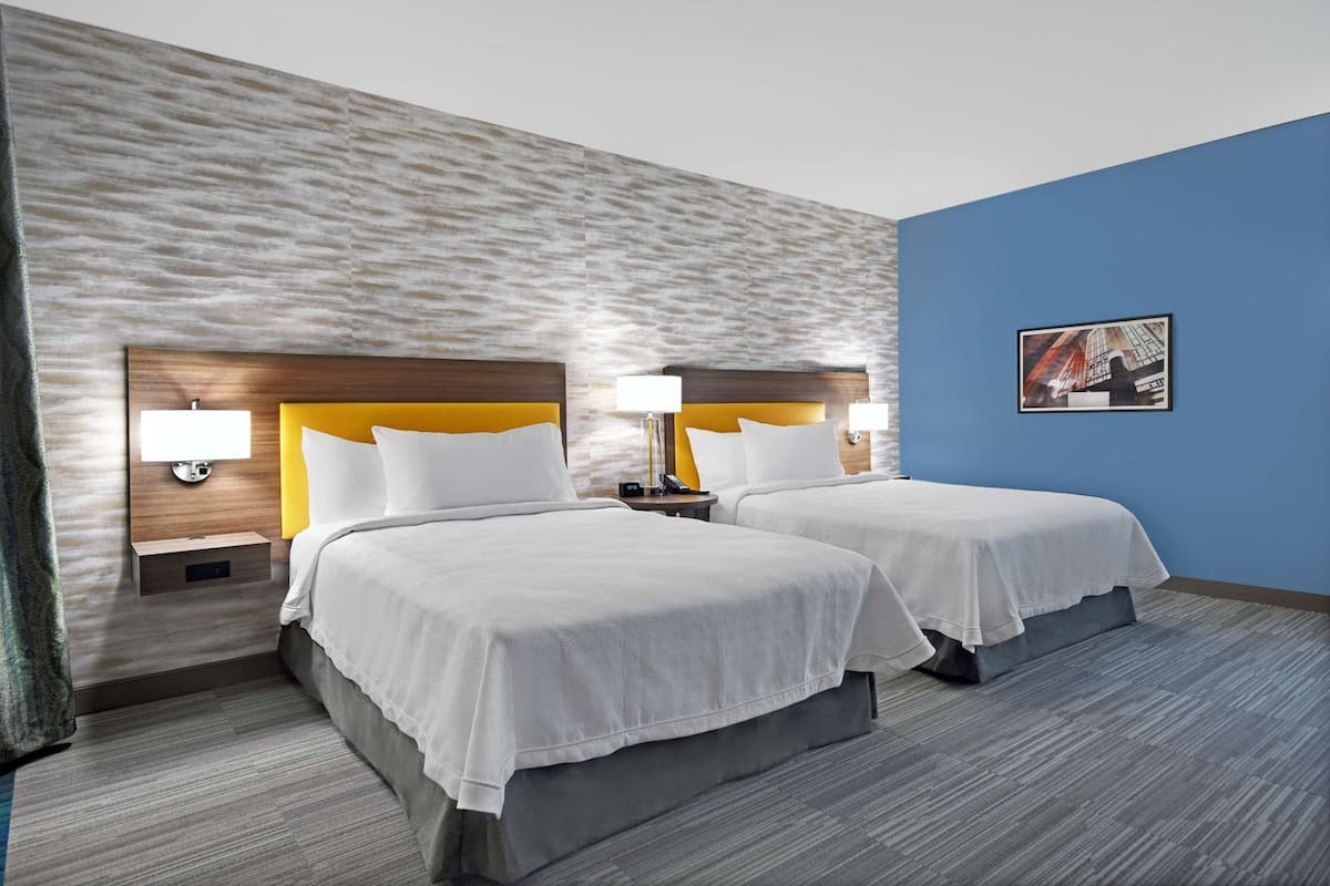 Hypo-allergenic bedding, desk, laptop workspace, blackout curtains
