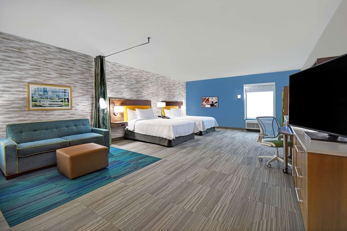 Hypo-allergenic bedding, desk, laptop workspace, blackout curtains