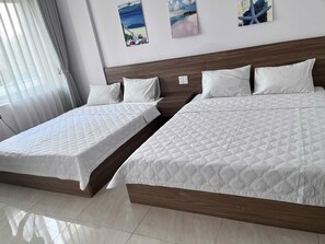 Standard Quadruple Room | Blackout drapes, free WiFi - South Flower Hotel (Nha Trang)